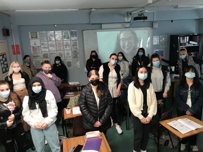 A group of people wearing masks

Description automatically generated with medium confidence